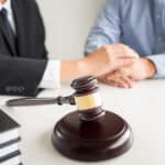 Lawyer giving legal advice with a gavel on the table