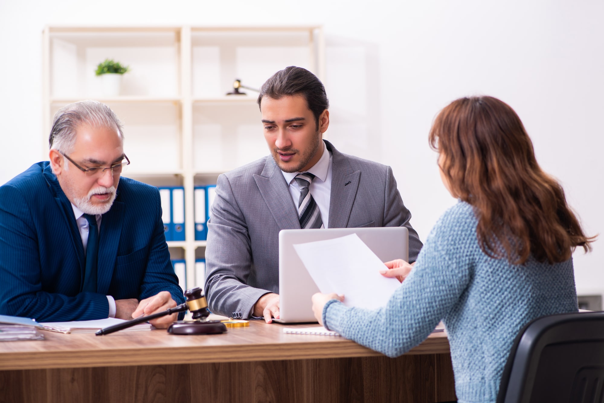 A group of attorneys reviewing case files together