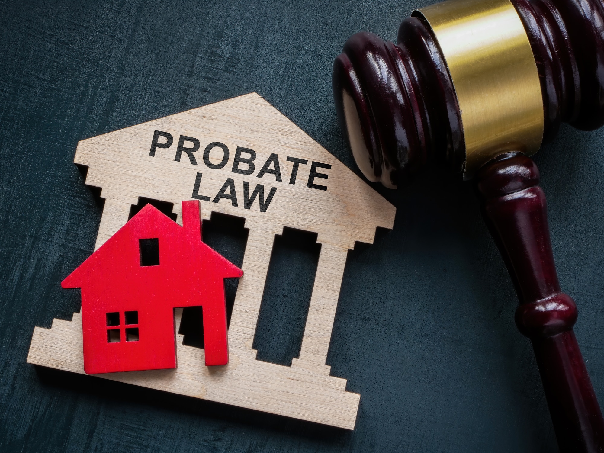 Probate law concept. Gavel and house model.